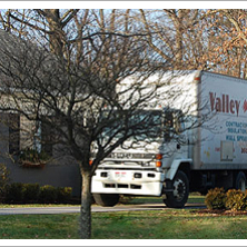 Valley Insulation truck in a driveway of a home