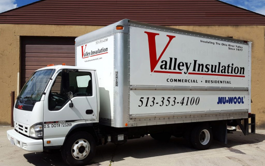 Valley Insulation truck in front of a storage facility