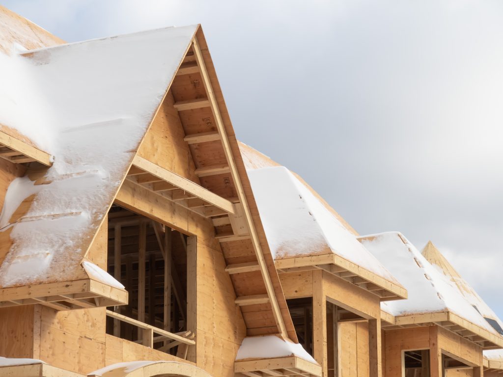 A snow covered residential construction project